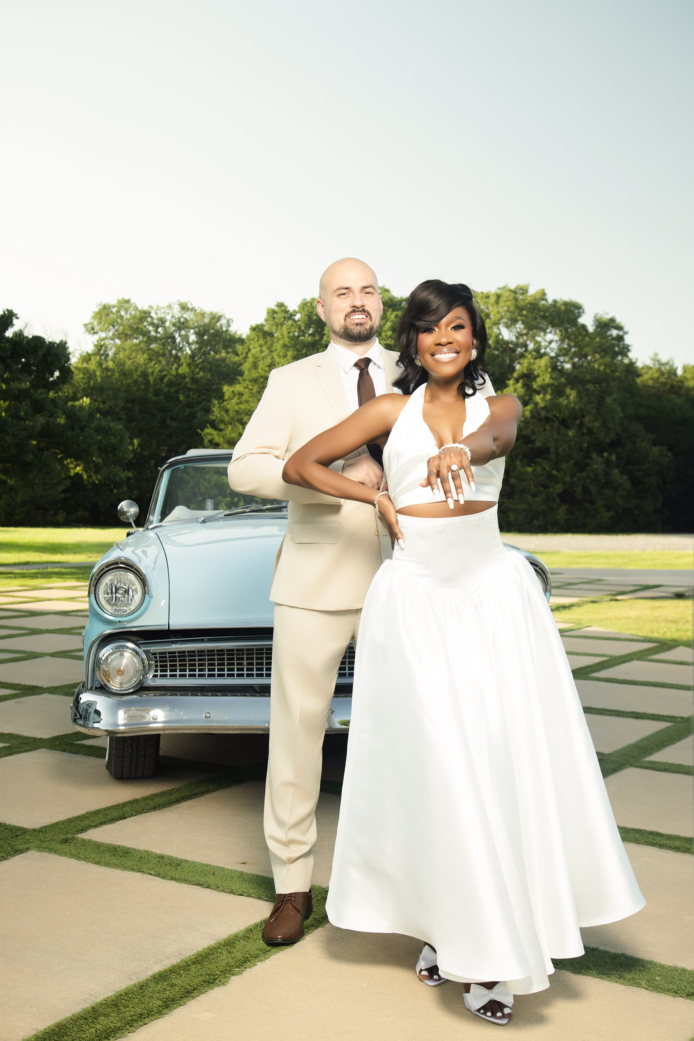 Thelma and Joe in a vintage convertible
